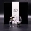 Two ornate glass goblets with bronze animal bases displayed before a black “Mystical Creatures” box.