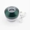 A small green and white spherical portable wireless speaker with control buttons and a charging cable.