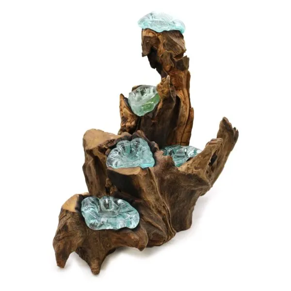 Molten glass bowls fused with twisted driftwood sculpture resembling a cascading natural waterfall.