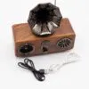 Vintage Wooden Bluetooth Gramophone Speaker - Metallic Horn A vintage-style wooden Bluetooth gramophone speaker with metallic horn and two connecting cables.