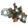 Sea-green glass tealight holders on a natural driftwood base for rustic coastal home décor.
