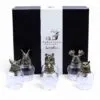 Wild Forest Animal Glass Tumblers - Bronze Base Luxury Set Five glass tumblers with bronze animal head bases displayed before a black luxury gift box.