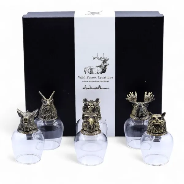 Wild Forest Animal Glass Tumblers - Bronze Base Luxury Set Five glass tumblers with bronze animal head bases displayed before a black luxury gift box.