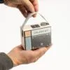 Pastel Retro Portable Radio Speaker - Cream Blue With Silver Knob Person holding a pastel retro portable radio with a silver knob and perforated speaker grille.