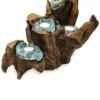 Handcrafted driftwood candle holder with aquamarine glass cups and white tealight candles.