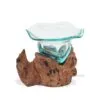 Hand-blown glass bowl resting on natural driftwood base, rustic decorative home art piece.