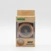 A small wooden mini speaker in woodgrain packaging with clear display window and green lettering.