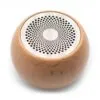 A small round wooden Bluetooth speaker with a silver perforated metal top on a white background.
