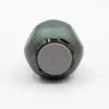 A compact matte green cylindrical electronic device with grey circular control buttons on a white background.