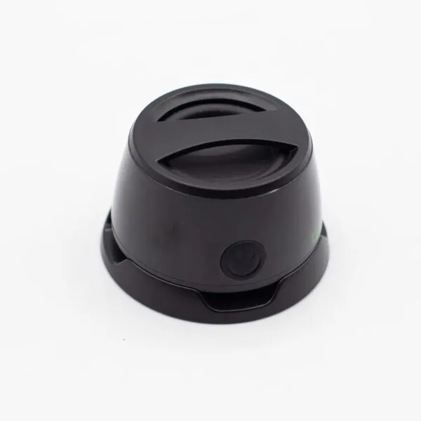 A small black plastic travel mug lid with an X-shaped handle on a white background.