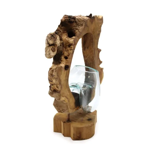 bG9jYWw6Ly9tZWRpYS9TUC9BQy82MFIzMEMxRzZSVjNBQ1NQLzA4YjFhMDc1LmpwZWc.webp Hand-blown glass vase fused with natural driftwood base, creating a rustic decorative sculpture.