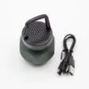 A green portable Bluetooth speaker with black grille and USB-C charging cable on a white background.