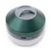 A small metallic green portable speaker with USB-C port and white translucent base on white background.