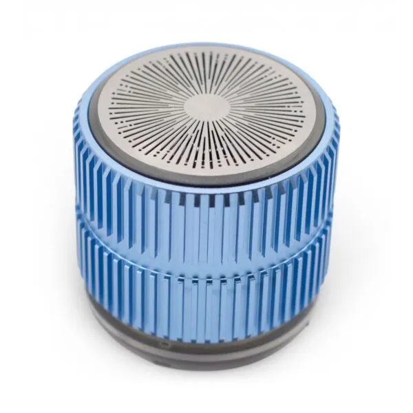 A compact metallic blue portable speaker with a silver perforated top and ridged aluminium body.