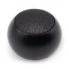 Compact black spherical matte speaker with perforated grille on white background.