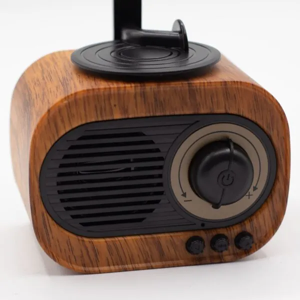Vintage wood‑grain Bluetooth speaker with volume dial, retro design, and modern wireless functionality.