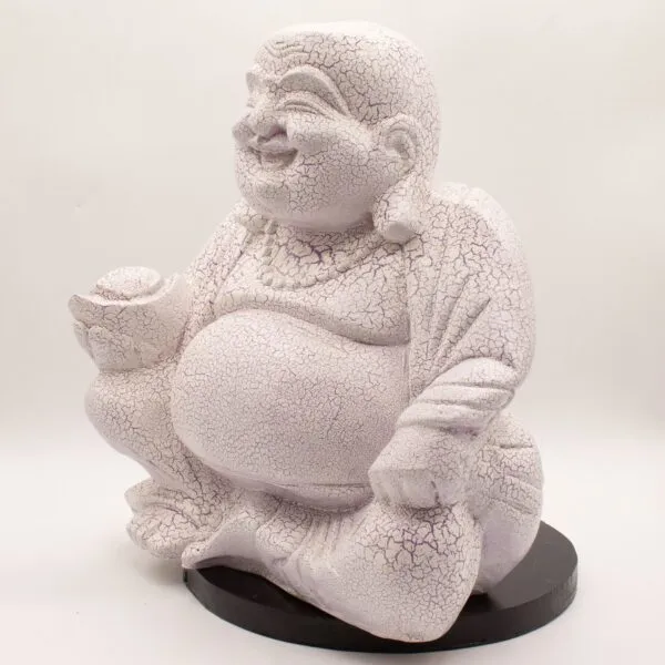 A crackle-glazed Laughing Buddha statue sitting cross-legged on a black base, smiling peacefully.