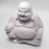 A cracked lavender Laughing Buddha statue with a joyful smile and rounded belly on a plain background.