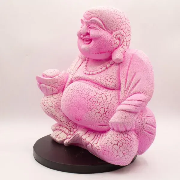 Pink ceramic Laughing Buddha statue with a crackle glaze, holding an offering bowl.