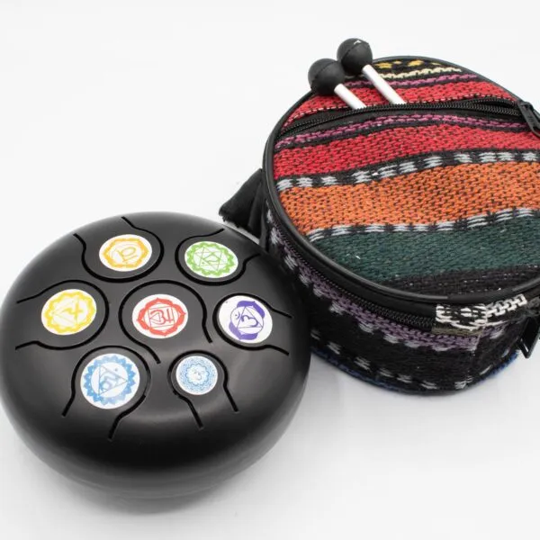 Black steel tongue drum with colourful chakra symbols, patterned carrying case, and wooden mallets.