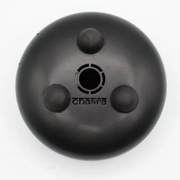 Top-down view of a matte black Chakra tank drum base on a white background.
