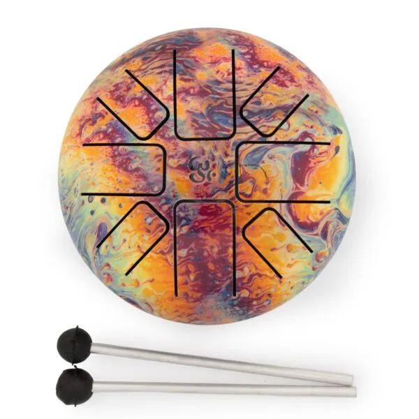 A colourful tie-dye steel tongue drum with two mallets on a white background.