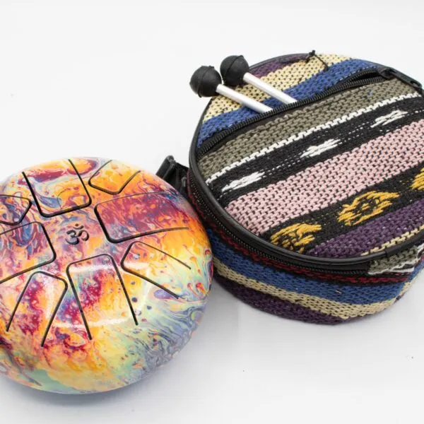 Colourful cosmic steel tongue drum and patterned fabric carrying bag with mallets.