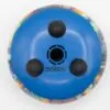 Underside of a blue circular tongue drum with rubber feet on a white background.