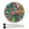 Colourful steel tongue drum with paisley pattern and two mallets on a white background.
