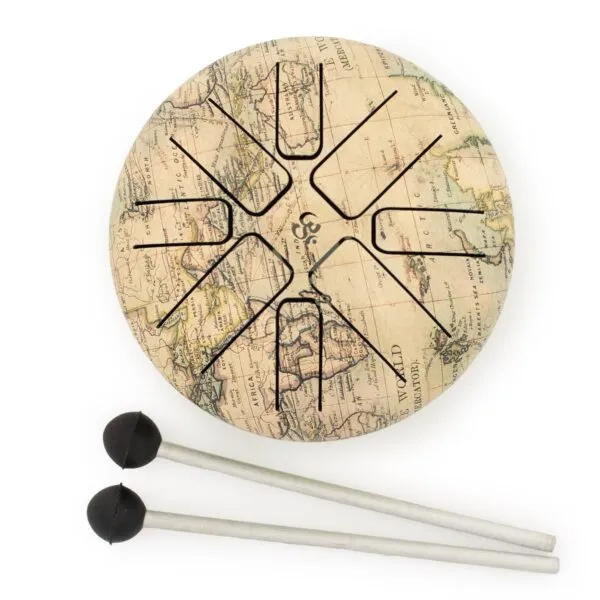 A round steel tongue drum with an antique world map design and two drumsticks.