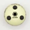 Bottom of an off-white steel tongue drum with rubber feet and Chakra text.