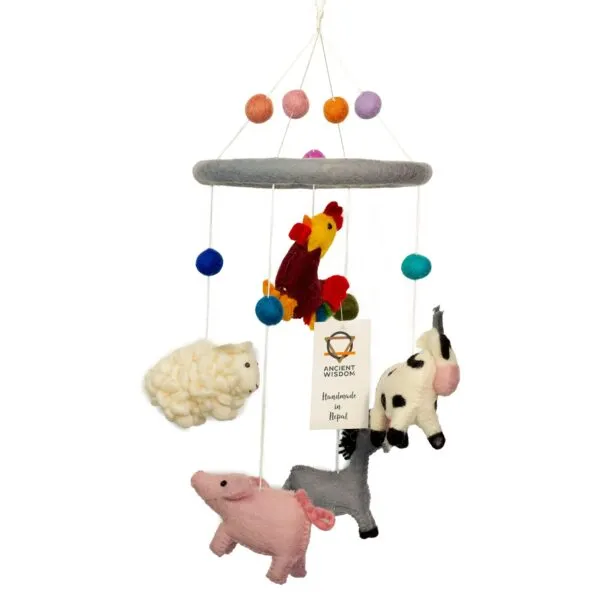 Handmade felt farm animal baby mobile featuring colourful wool figures and felt balls.