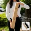 Long Wooden Rain Sticks - Woman holding a Manglid Wood Healing Rainstick