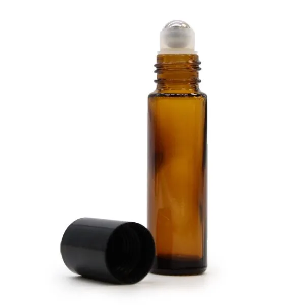 Amber glass essential oil roller bottle with metal rollerball and detached black cap.