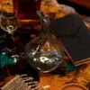 bG9jYWw6Ly9tZWRpYS85Uy9BRS82MFIzMEMxSjY0UktBRTlTL2ZmNTA5ZjY1LmpwZw.webp Molten Glass Mini Decanter on Wood 20cm