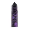 A black hexagonal crystal obelisk with deep purple celestial sun and moon engravings.