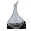 bG9jYWw6Ly9tZWRpYS8xSi9DQy82MFIzMEMxSjY0UktDQzFKL2U5NjExMDg0LmpwZw.webp Molten Glass Mini Decanter on Wood 20cm