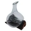 bG9jYWw6Ly9tZWRpYS8xTS9DQy82MFIzMEMxSjY0UktDQzFNLzU2N2NlZTYyLmpwZw.webp Molten Glass Mini Decanter on Wood 20cm