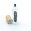 bG9jYWw6Ly9tZWRpYS9ISi9DRC82MFIzMEMxRzZSVktDREhKLzI3ZGJjODI1LmpwZWc.webp Gemstone Essential Oil Roller Bottle - Sodalite - Wooden Cap