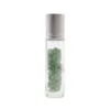 Clear glass rollerball bottle filled with green aventurine chip stones and a silver cap.