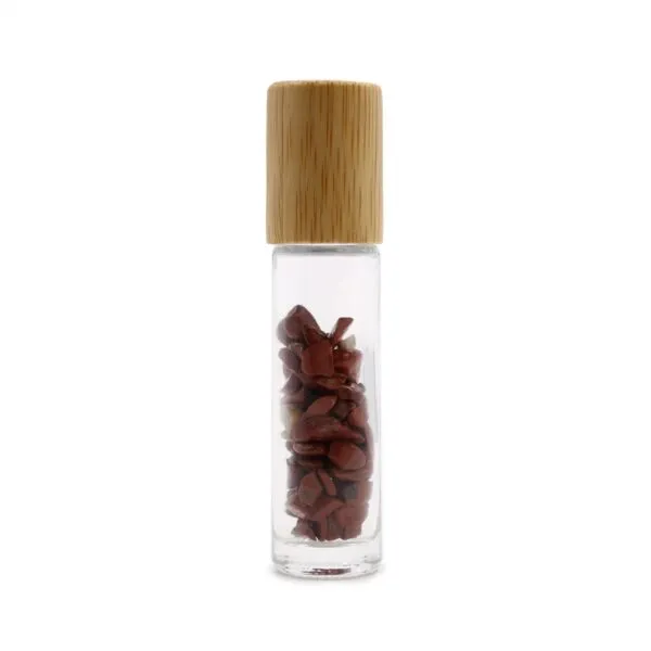 Clear glass roller bottle with a bamboo cap, filled with red jasper crystal chips.