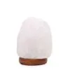 Unfinished white rock salt crystal lamp on a rounded dark wooden base.