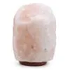Large natural pale pink Himalayan salt rock lamp on a dark wooden base.