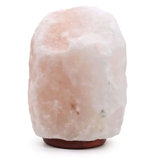 Large natural pale pink Himalayan salt rock lamp on a dark wooden base.