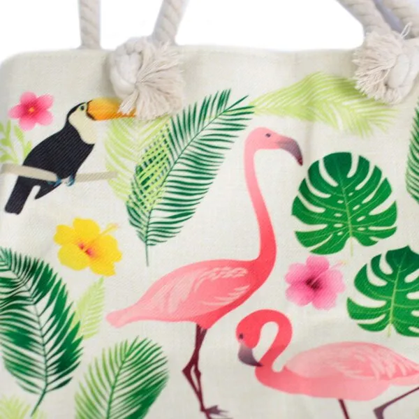 Cream woven canvas beach tote bag featuring a tropical flamingo print and rope handles.