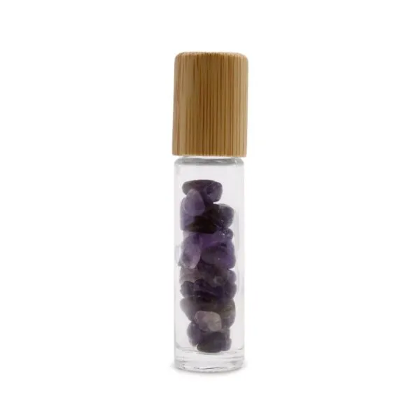 Clear glass essential oil roller bottle with a bamboo cap and purple amethyst crystals.