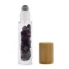 Amethyst gemstone glass roller bottle with purple crystal rollerball and natural bamboo cap.