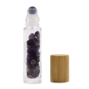 Amethyst gemstone glass roller bottle with purple crystal rollerball and natural bamboo cap.