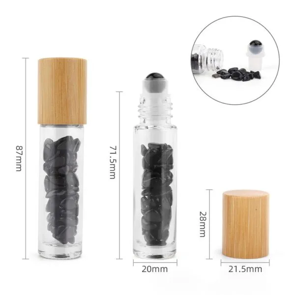 Clear glass gemstone roller bottles filled with black tumbled stones, bamboo caps and dimensions.