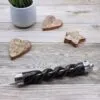 Black twisted wooden magic wand with a clear crystal ball and point.
